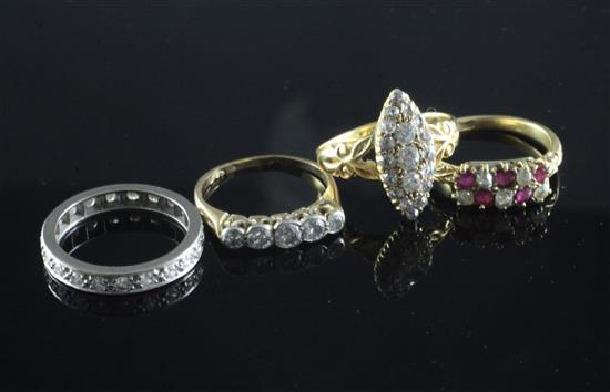 Four 18ct gold gem set rings including diamond cluster, ruby & diamond and a diamond full eternity, various sizes.